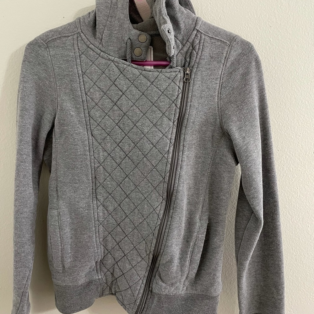 So grey zip up jacket